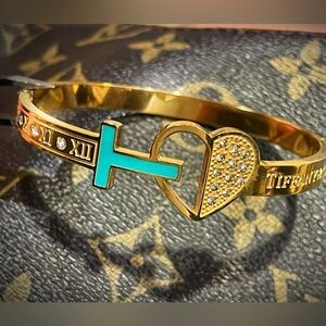 Tiffanee monogram logo bracelet to match your bag or first just beautiful! 😭😱💕🔥